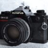 Olympus OM-4 Ti | black | mit Zuiko 1,8 / 50 mm